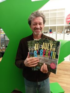 Markus Heckhausen holding copies of our July 2026 magazine in which he was featured